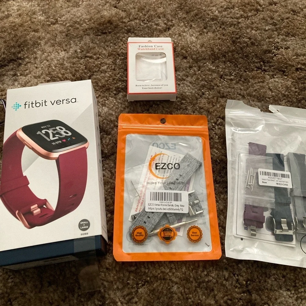 Rose Gold Fitbit Versa with Accessories all in excellent condition